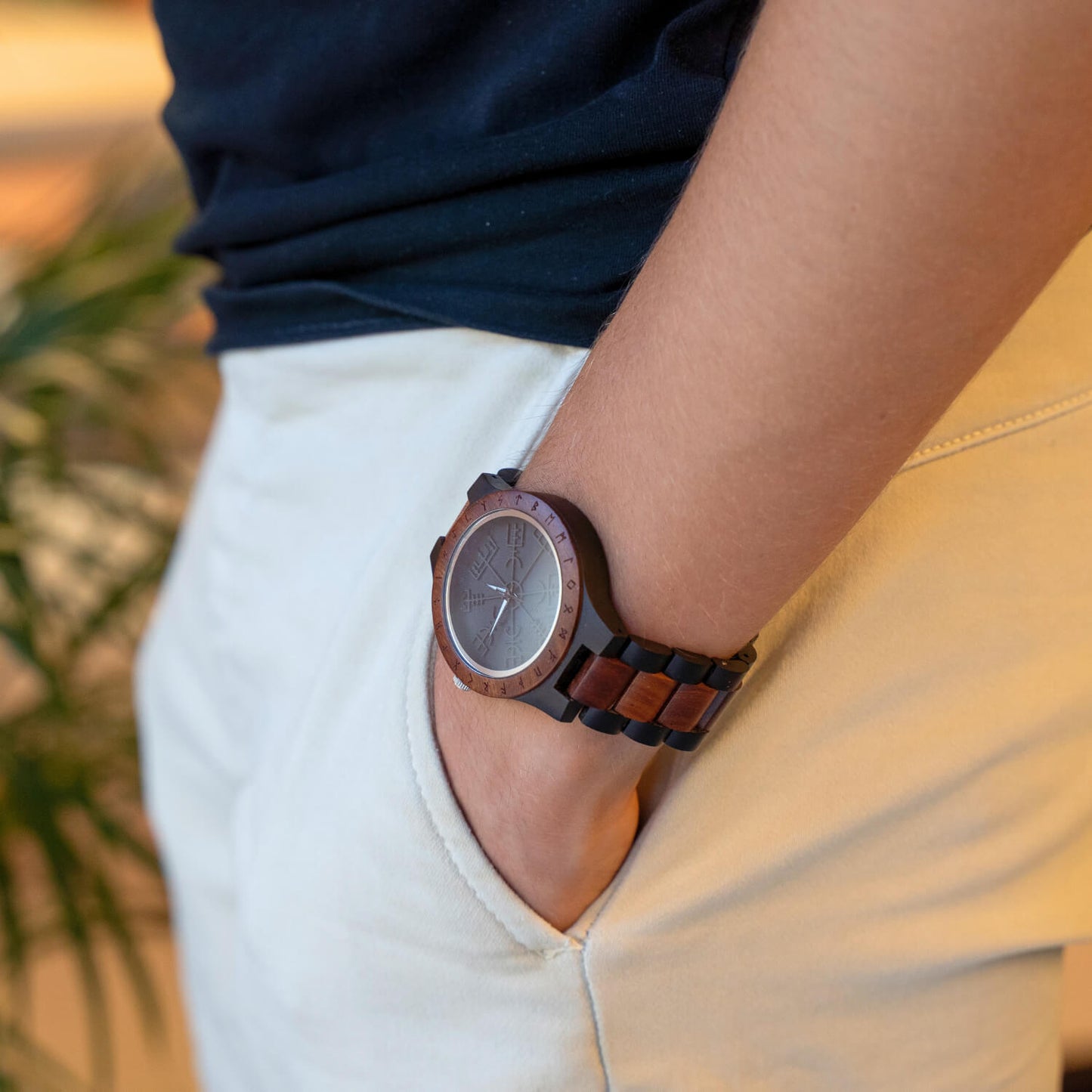 Person wearing a viking vegivisir wooden watch