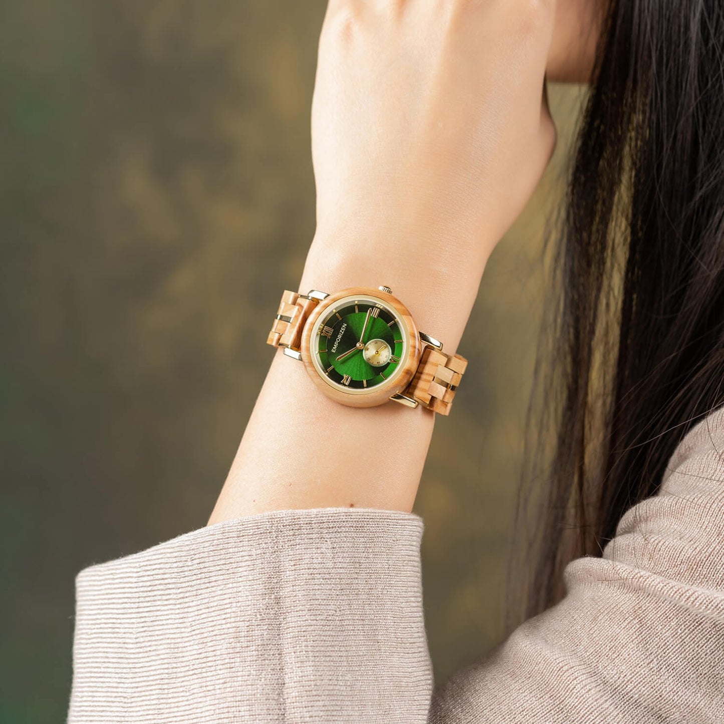 Lady wearing Luxury Womens Wooden Watch Emerald on her wrist