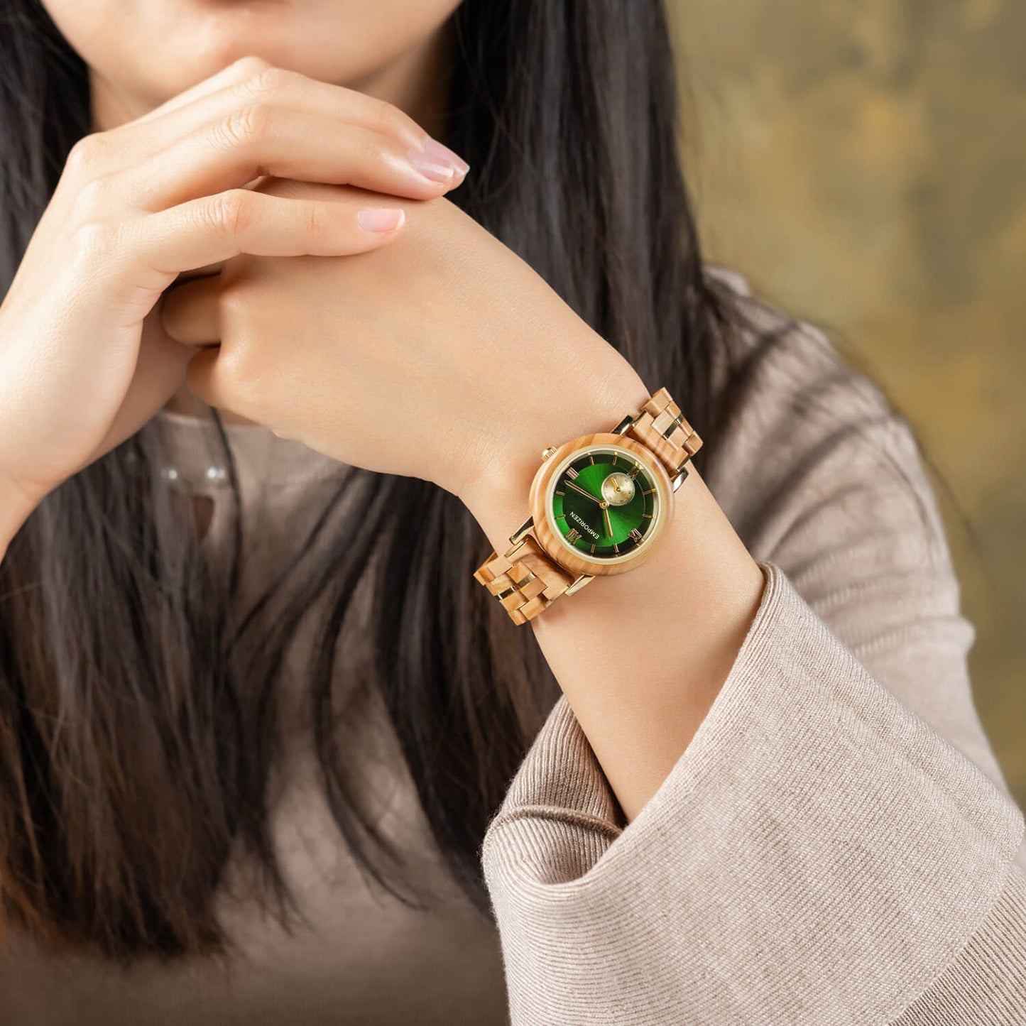 Woman wearing Luxury Womens Wooden Watch Emerald on her wrist