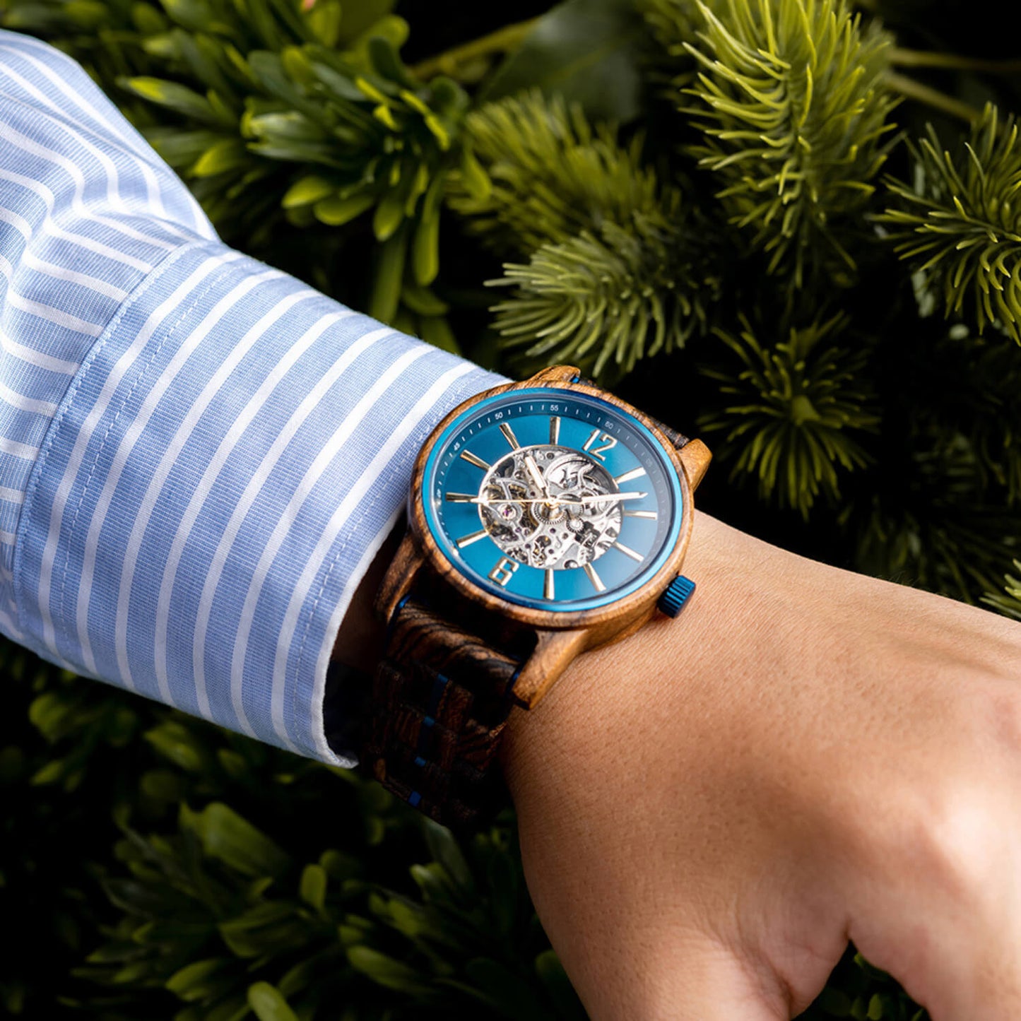 Man wearing Men's Oceanus Blue Automatic Wooden Watch on his wrist