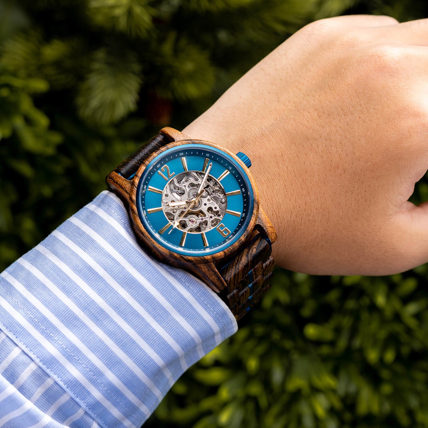 Model wearing Men's Oceanus Blue Automatic Wooden Watch on his wrist