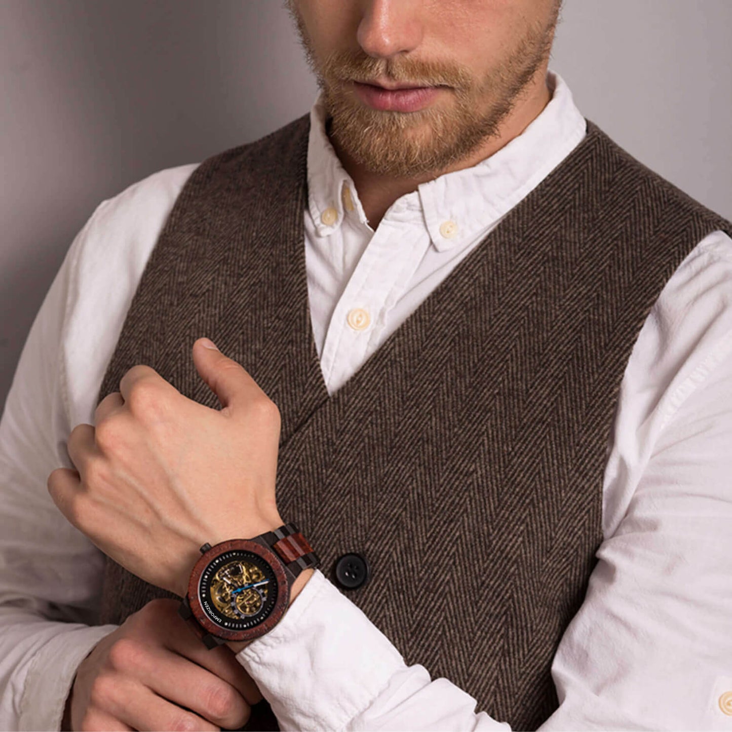 Man wearing Phoenix Red Men's Automatic Wooden Watch on his wrist