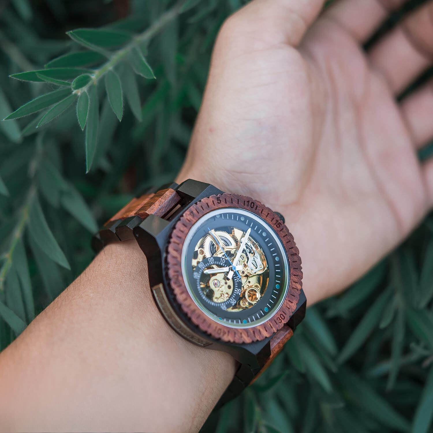 Model wearing Phoenix Red Men's Automatic Wooden Watch on his wrist